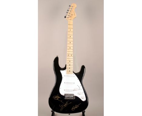 A black California electric guitar signed in gold metallic felt-tip pen, ‘Eric Clapton’, ‘Jack Bruce’ and ‘Ginger Baker’; acc