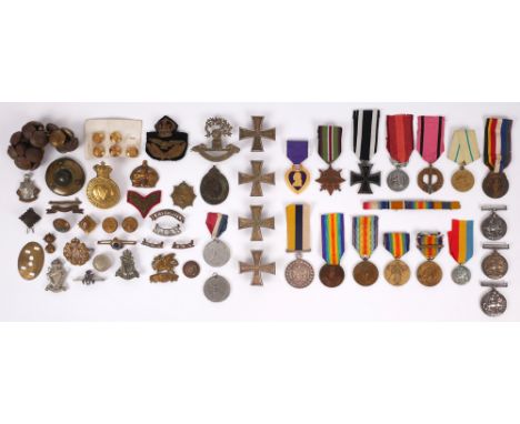 A collection of military medals, badges and buttons. 16 military medals including three British War Medals to 20883 Pte. F. J