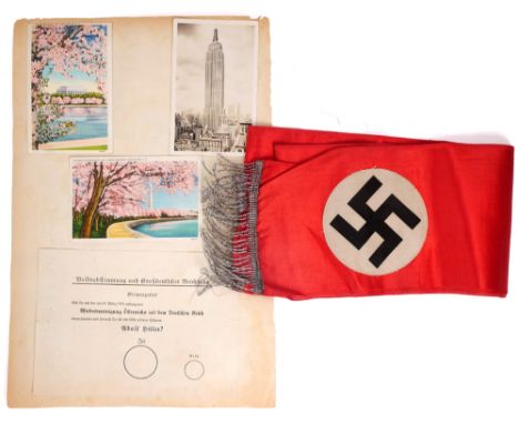 1938 Anschlauss campaign leaflet and Nazi sash. A page from a scrapbook with postcards of Washington and New York pasted abov