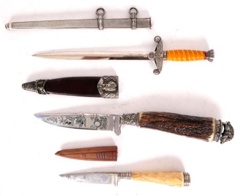 1932-1945 Paper knife German Wehrmacht and two hunting knives. A paperknife in the form of a miniature Wehrmacht officer's da