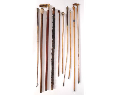 Collection of walking canes, riding crops and swagger sticks. A silver mounted blackthorn, a walking cane with compass and su