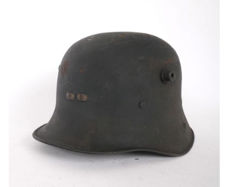 1927 pattern Irish Army helmet by Vickers A coal-scuttle shaped helmet made by Vickers in the UK, in original finish, with le