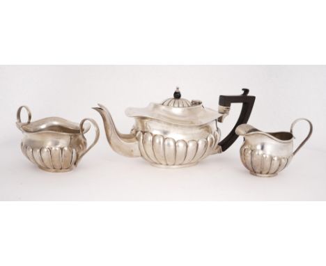 Edwardian silver bachelor tea set. An early 20th century, silver, three-piece 'bachelor' tea-set, comprising teapot, sugar bo