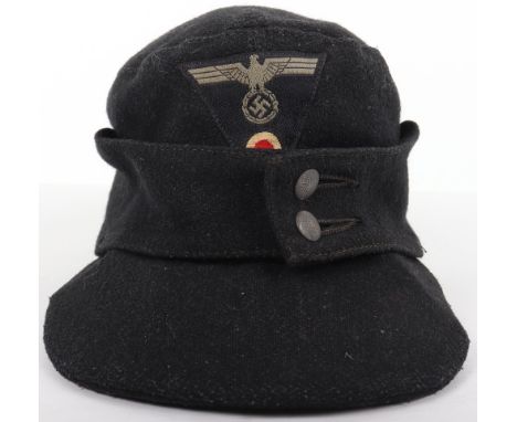 German Army Panzer M-43 Field Cap, coarse black wool body with two button front. Bevo one piece Panzer pattern eagle and cock
