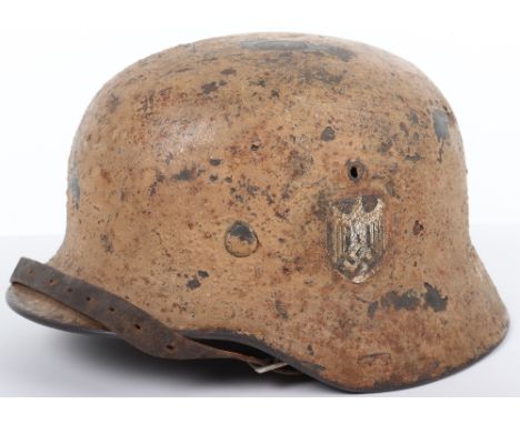 German Army Afrika Korps (D.A.K) Camouflaged Steel Combat Helmet, M-35 pattern combat helmet which has a thick rough textured