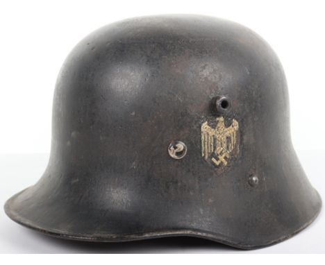 Austrian Model M16/17 Transitional Steel Combat Helmet, dark black painted finish with German army single decal. Aluminium ba