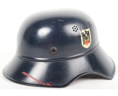 Deutsche Rotes Kreuz (D.R.K) Steel Helmet, being a gladiator pattern helmet with dark blue paint finish to the exterior and i
