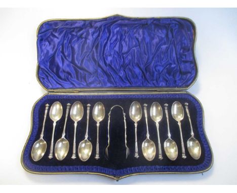 A cased set of 12 silver teaspoons and tongs, a cased pair of silver christening flatware and further assorted flatware, 43.3