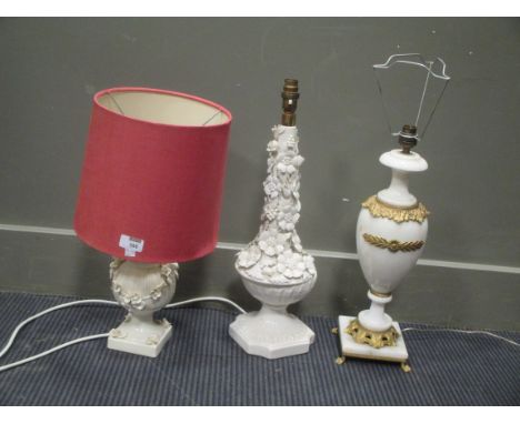 An Italian alabaster and gilt metal table lamp together with two white ceramic floral encrusted lamps and a mid 20th century 