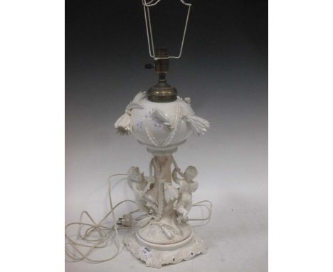 A white china floral lamp with modelled putti