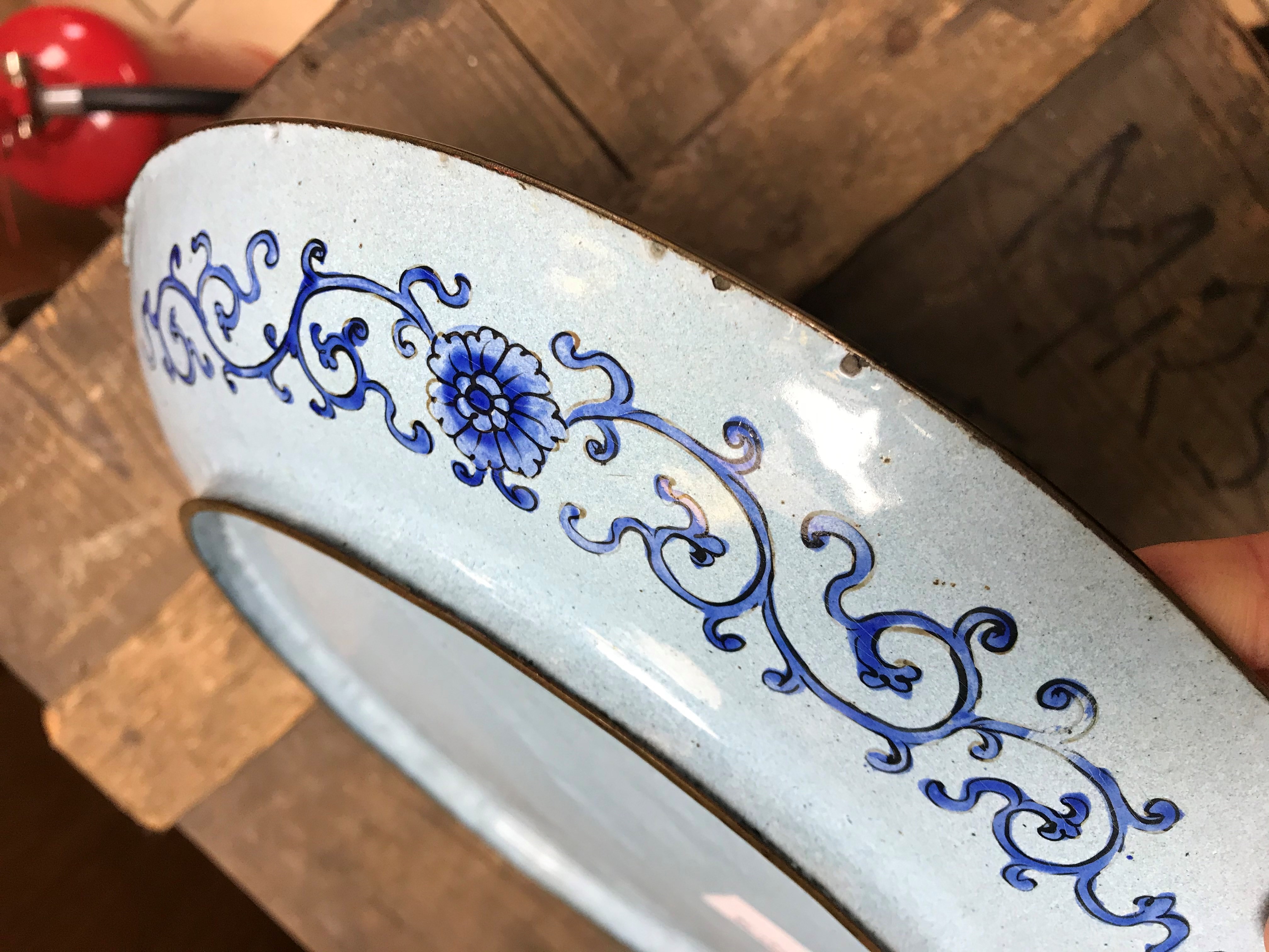 A pair of Cloisonné plates, the blue ground decorated with peonies