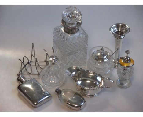 A collection of silverware including two cased sets of salts, a sauce boat, two hip flasks, a toast rack (AF), a glass whisky