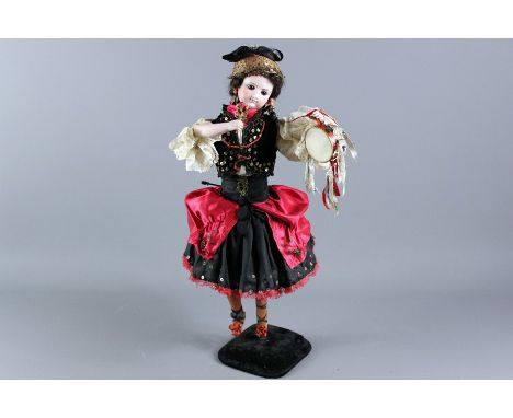 Antique Automaton Gypsy Rose, the bisque headed doll with brown glass eyes and painted features, porcelain arms and legs, wea