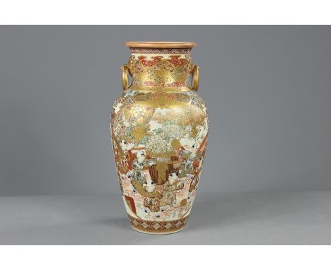 A Late 19th Century Japanese Kutani Vase, painted with figures beside the shore, approx 30 cms h, heightened with gilt and wh