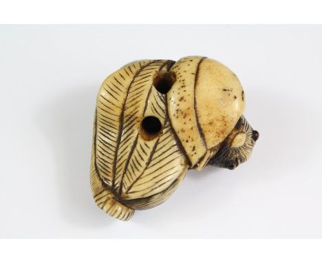 A Japanese Netsuke; the netsuke depicting a mouse feeding, approx 45 x 40mm, unsigned.