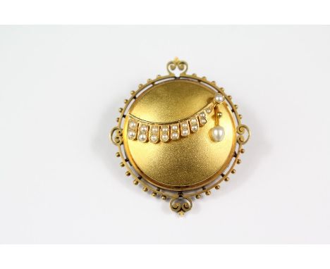 An Edwardian 14ct gold and seed pearl brooch. The brooch measures approx 30 x 30mm, approx 9.7 gms.
