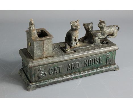 Vintage 'Cat and Mouse' money box, approx 19 x 7 x 13 cms, most of the enamel has worn off over time.