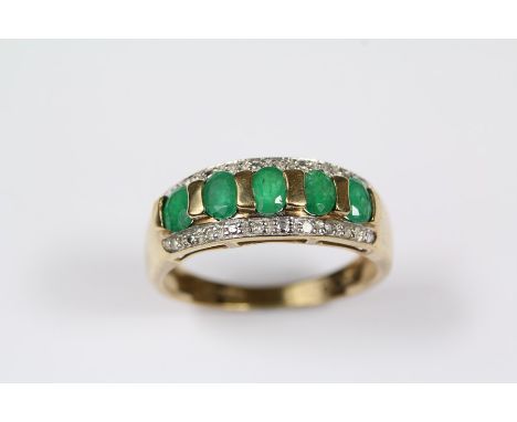 9ct yellow gold and emerald ring, set with five emeralds approx 4 x 3 mm with approx 5 pts of dias, size P, approx 2.8 gms.