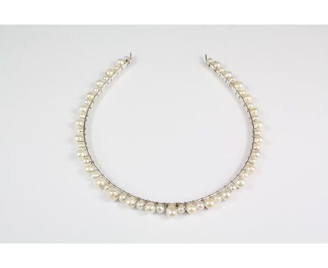 A silver wire and cultured pearl tiara.