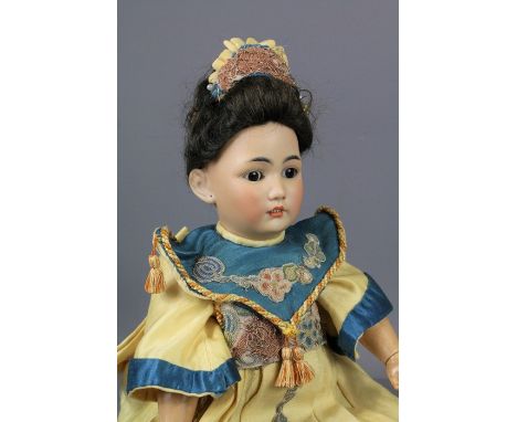 Two antique German dolls. The first doll having a bisque head with sleeping eyes, an open mouth revealing teeth and painted f