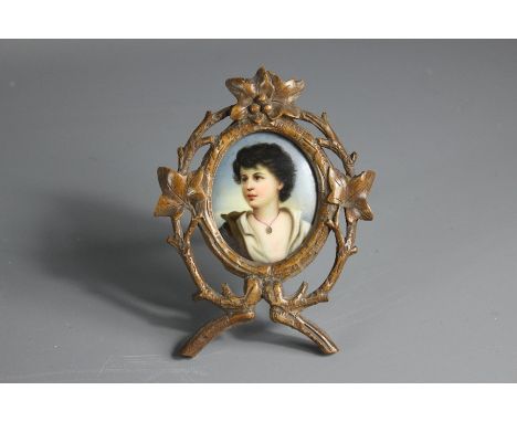 Porcelain portrait miniature, depicting a Neapolitan boy, artist marks rubbed, presented in a black forest frame, approx 6h x