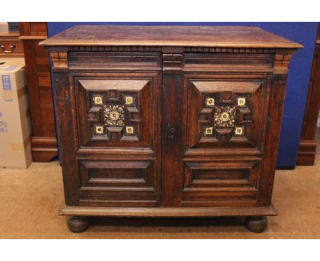 Charles II Period Oak Chest of Drawers, the chest having a pair of moulded doors with decorative inlay of bone and mother of 