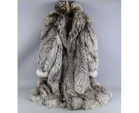 Full length silver fox fur coat, the coat labelled SAGA Fox and Superb Ranched Fur made in Italy, button to top with three fr