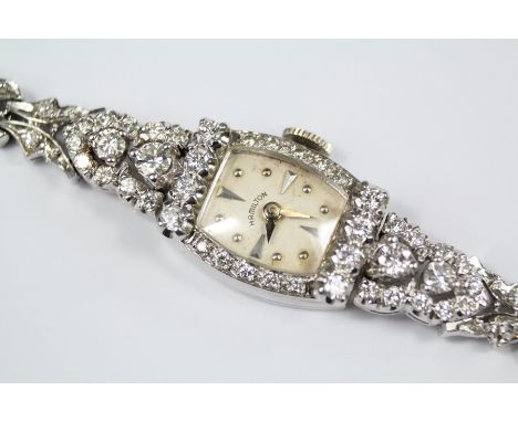 A Lady's Antique Hamilton 14ct White Gold and Diamond Cocktail Watch. The watch having a champagne face with baton and stud d