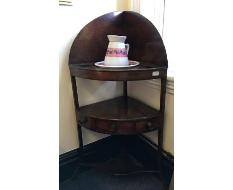 A 19th Century mahogany corner wash stand with single drawer plus jug and basin.
