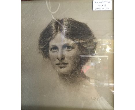 FRED YATES. Framed, signed, dated 1909, charcoal sketch on paper, head study portrait of a young lady, 23.7cm x 20cm.