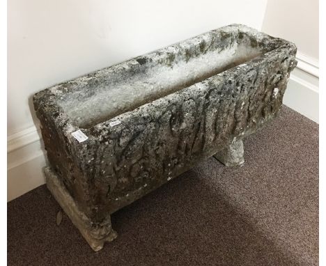 A concrete garden plant trough.