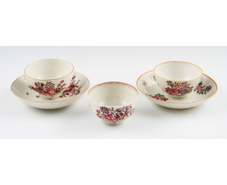 Two 18th Century Worcester porcelain tea bowls and saucers with floral decorations together with another similar tea bowl wit