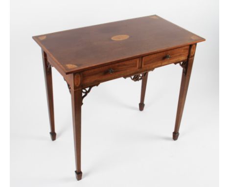 An early 20th Century Edwardian mahogany two drawer table with inlaid shell decoration to top plus open worked skirting and b