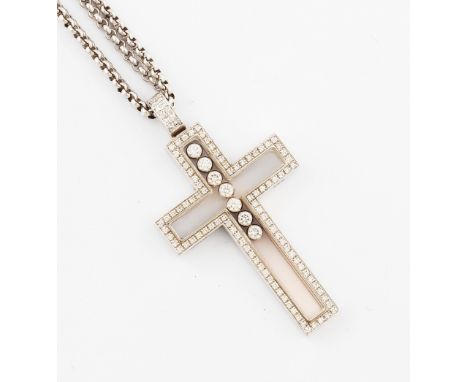 A Chopard 'Happy Diamonds' cross pendant, with seven free moving round brilliant cut diamonds and a border of round brilliant