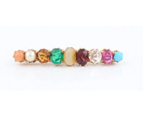 A nine stone multi gemstone bar brooch, gemstones include a turquoise cabochon, ruby, emerald, garnet, pearl and coral, set i