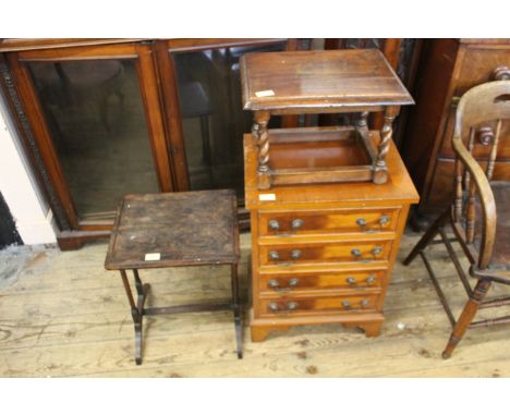 A small four drawer chest, a rosewood lamp table and an oak stool