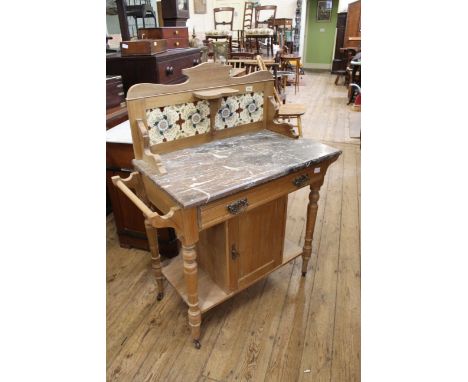 A late Victorian satin walnut washstand with tile back