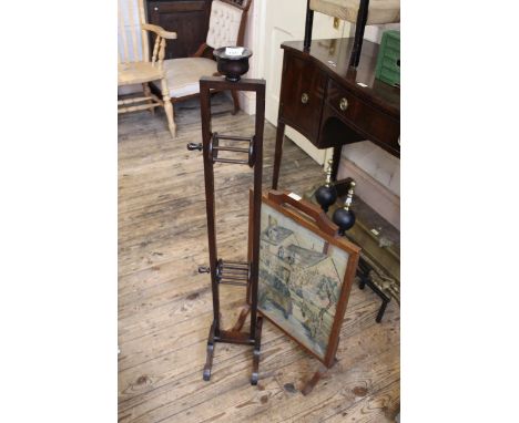 An Edwardian mahogany wool winder and a framed tapestry firescreen