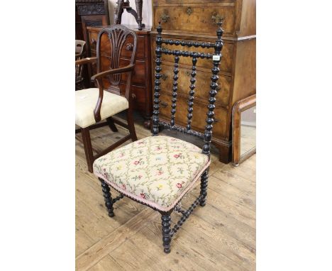 A late 19th Century ebonised bobbin turned chair