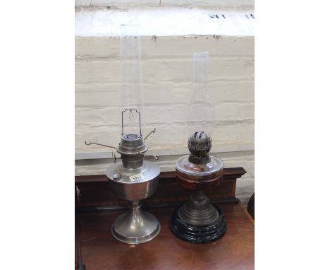 A brass oil lamp and a metal oil lamp