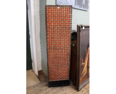 An unusual floor standing 1960's wicker standard lamp