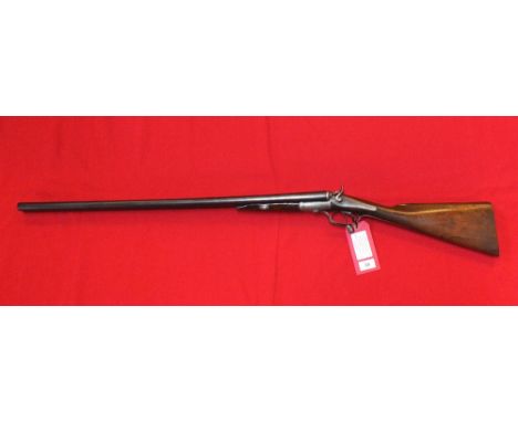A 12 bore double-barrel hammer shotgun by Boss & Co, S/No.2122, this classic English hammer gun has 30" barrels and comes wit