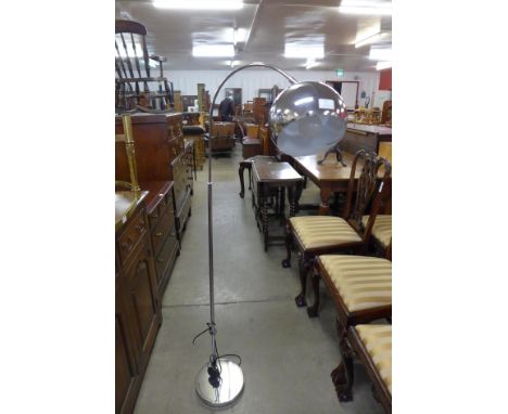 A chrome floor standing arc lamp 