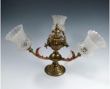 A gilt metal three branch light fitting, with floral swags, the twist branches having copper leaves, height 12ins, together w