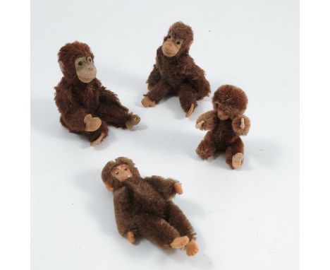 Four plush monkeys, two with pressed metal faces, one with Steiff button to its foot