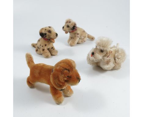 A Steiff plush dog,&nbsp;Bazi, with paper label, together with a Steiff dog, Snobby, with paper label and two other plush dog