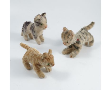A Steiff plush cat, together with two other plush cats