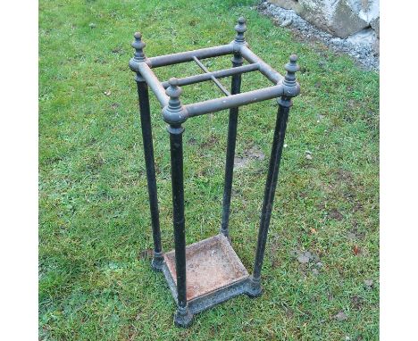 A 19th century design metal stick stand, having four divisions, height 26.5ins x width 9ins