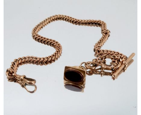 A 9 carat gold watch chain, of solid uniform curb links, with two swivels and a T bar, also a carnelian set seal fob attached