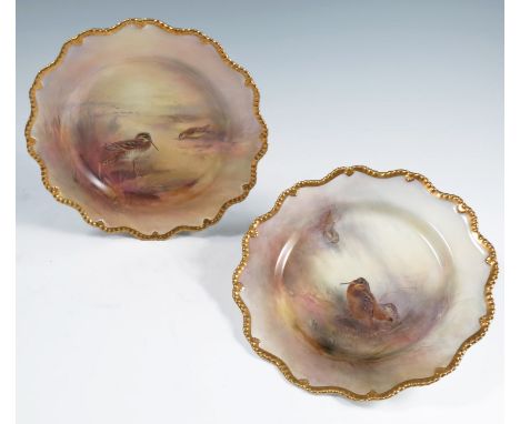 Two Royal Worcester cabinet plates, decorated with Woodcock and Snipe in landscape, both by Jas Stinton, with gilt shaped edg